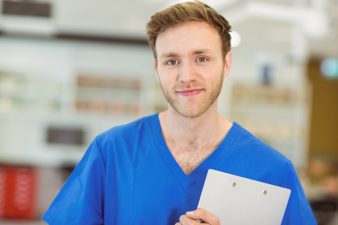 Young medical student smiling at the camera at the university